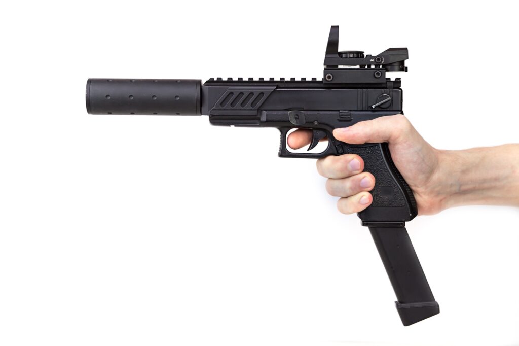 game weapon for airsoft in hand on a white background